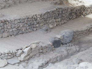 Two blocks embedded in a Minoan wall from the increased excavation of Phase 2. They are roughly .75 and 1 meter wide.