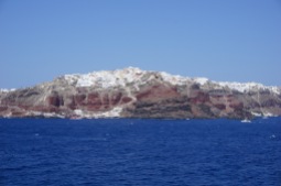 Oia, as seen from the ferry through the north passage of Santorini