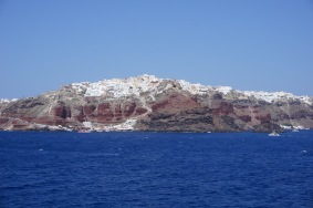 Oia, as seen from the ferry through the north passage of Santorini